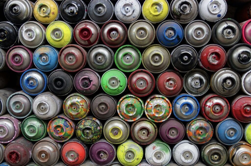 piles of aerosol cans